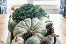 06 a dough bowl with pumpkins, pinecones and greenery is a cool rustic centerpiece for fall and Thanksgiving