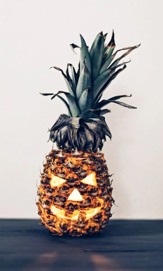 a pineapple jack-o-lantern is a fun take on a traditional one