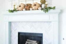 08 a catchy rustic mantel with faux pumpkins, greenery, dried blooms in a vase, gold candleholders with pillar candles, branch-inspired candleholders on the wall