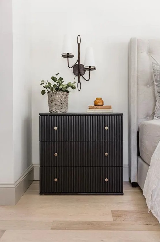 a cool IKEA Tarva dresser renovation into a trendy fluted piece with brass knobs, it becomes a functional nightstand