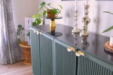16 a forest green fluted IVAR sideboard with gold handles, decor, potted plants and candles is a lovely idea for a modern space