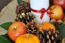 16 a natural fall centerpiece of a dough bowl, foliage, pinecones, nuts, acorns, apples, pumpkins and candles