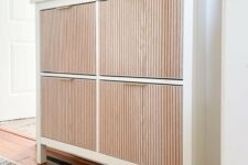 19 a lovely IKEA Hemnes shoe cabinet hack with fluted wooden panels, gold handles is a stylish and elegant idea