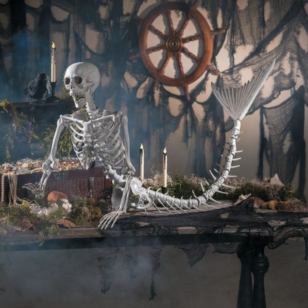  a mermaid skeleton would be a great addition to a tropical Halloween arrangement