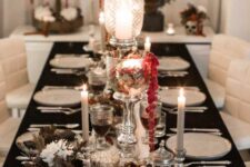 21 a beautiful and refined Halloween tablescape with dark and white blooms, a skull in a flower crown, some amaranthus