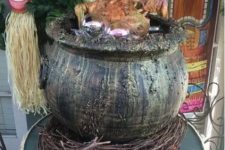 24 tiki party done right – a skeleton cooked in a cauldron is a cool idea for a tropical Halloween