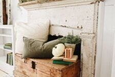 25 a neutral and relaxed fall fireplace with pillows and greenery, white pumpkins and cocnrete pots for a vintage feel