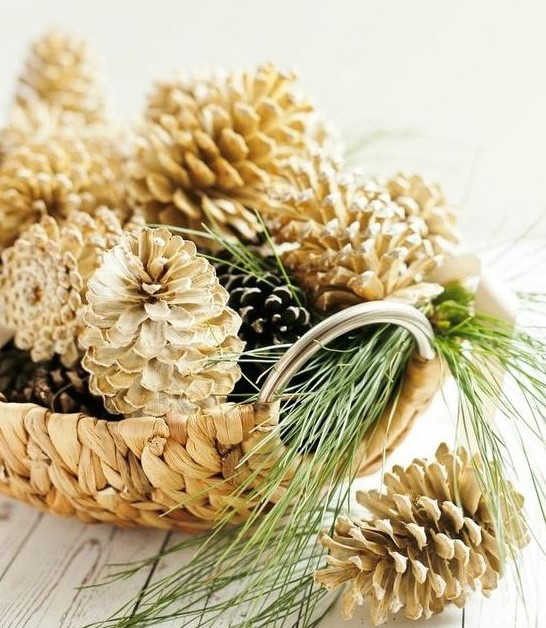 a wicker bowl with usual and bleached pinecones looks pretty   just add some evergreens