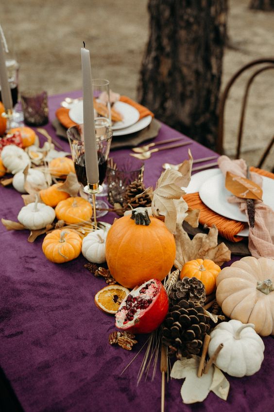 fall table decor with pumpkins, dried leaves, wheat, pomegranates and pinecones is very cool and all natural