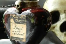 29 a beautiful blood bottle with twine and a skull can hold some faux blood or even tomato juice
