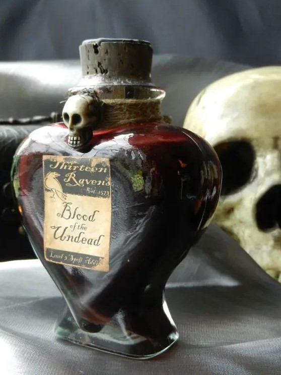 a beautiful blood bottle with twine and a skull can hold some faux blood or even tomato juice