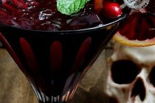 30 a bloody zombie rum cocktail with a pirate-themed stirrer is a cool idea for a Halloween celebration