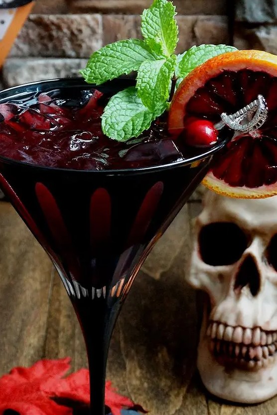 a bloody zombie rum cocktail with a pirate-themed stirrer is a cool idea for a Halloween celebration