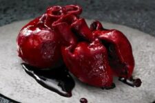 31 a bloody human heart cake is a bold and scary idea of a Halloween party dessert that you can order to impress everyone