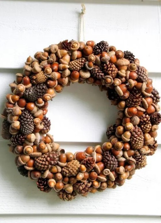 a cool natural fall wreath of acorns, nuts and pinecones is a timeless and long lasting idea to try