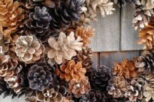 32 a cool wreath of pinecones of various shades is a very cool fall to winter decoration for your front door