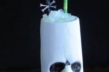 34 a tropical Halloween cocktail served in a zombie head is a cool and fun solution for your party