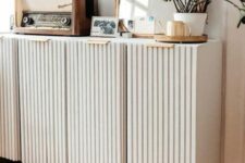 34 a white IKEA Ivar hack with fluting as a media console with storage space is a stylish idea for a modern space