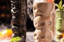 36 tropical Halloween cocktails served in skull stacks and head stacks are a great solution for a party