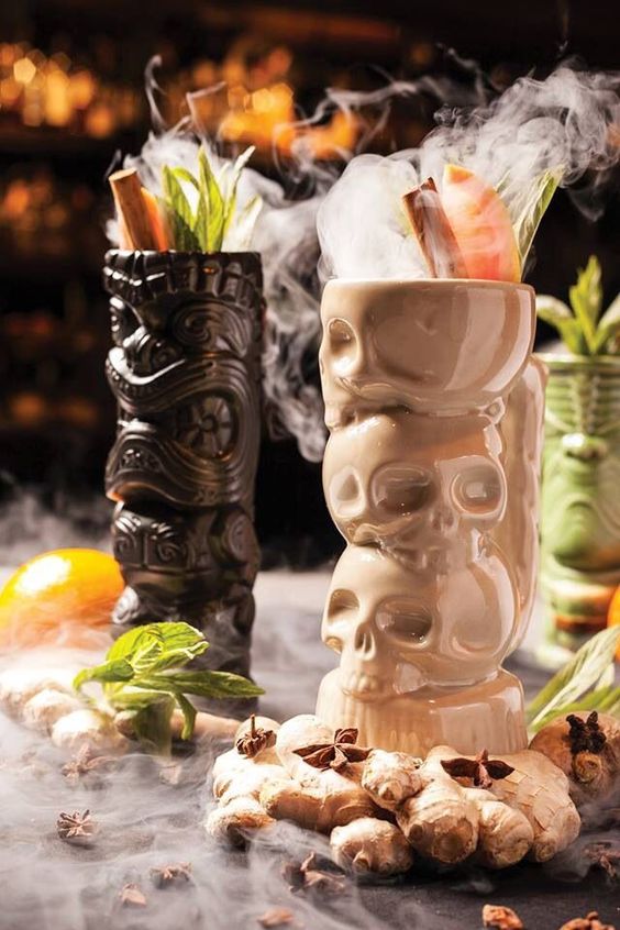 tropical Halloween cocktails served in skull stacks and head stacks are a great solution for a party
