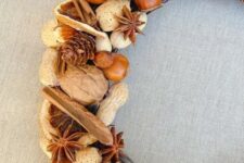 37 a rustic farmhouse wreath with nuts of various kinds, pinecones, cinnamon bark and lots of other stuff is a lovely harvest-inspired idea