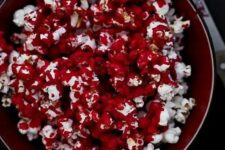 37 bloody popcorn is an easy and delicious treat for your Halloween party, make some using tutorials on the web