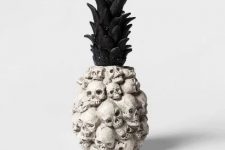39 a catchy tropical Halloween decoration shaped as a pineapple and made of skulls