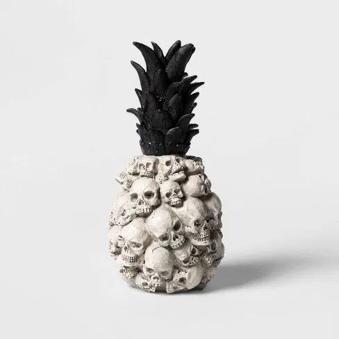 a catchy tropical Halloween decoration shaped as a pineapple and made of skulls
