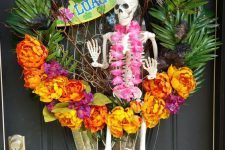 40 a crazy tropical Halloween wreath with tropical leaves and blooms, a skeleton ith a flower necklace