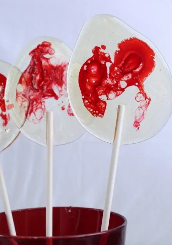 fantastic bloody lollipops are amazing for giving them as Halloween party favors or to serve them as desserts