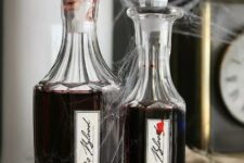 41 gorgeous idea for Halloween – pour some red wine into elegant bottles and add spooky stickers