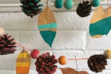 43 a colorful fall garland of bright beads, leaves and pinecones is a cool idea to decorate a colorful fall or Thanksgiving space