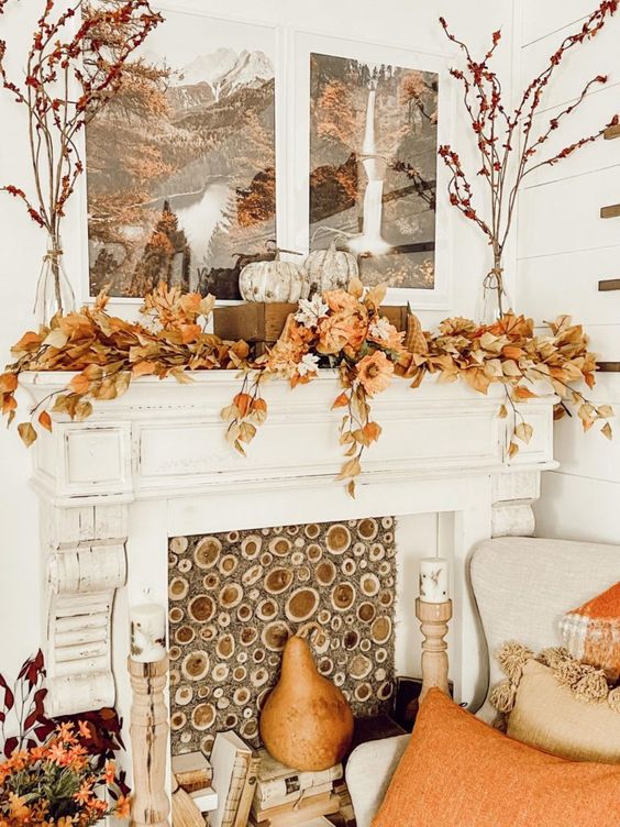 fall living room decor with a branch slice screen, fall leaves, heirloom pumpkins, faux pears and bright pillows