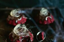 45 red velvet molten lava cakes with chocolate ganache and spun sugar on top for a Halloween party