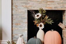 46 lovely fall fireplace styling with colorful pumpkins and a vase with faux blooms is an easy and lovely idea