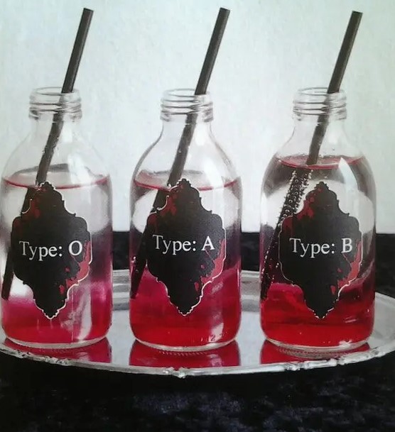 vampire party drinks are great and are super easy to DIY, add black straws and black stickers