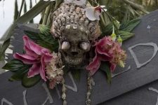 48 a shell decorated skull with tropical flowers for outdoor and indoor decor at a tropical party