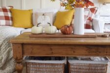 49 a bold fall leaf arrangement in a jug and some natural pumpkins for a rustic fall coffee table