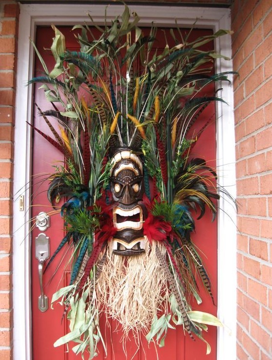 tiki masks could be used for Halloween decor too, instead of usual Halloween wreaths