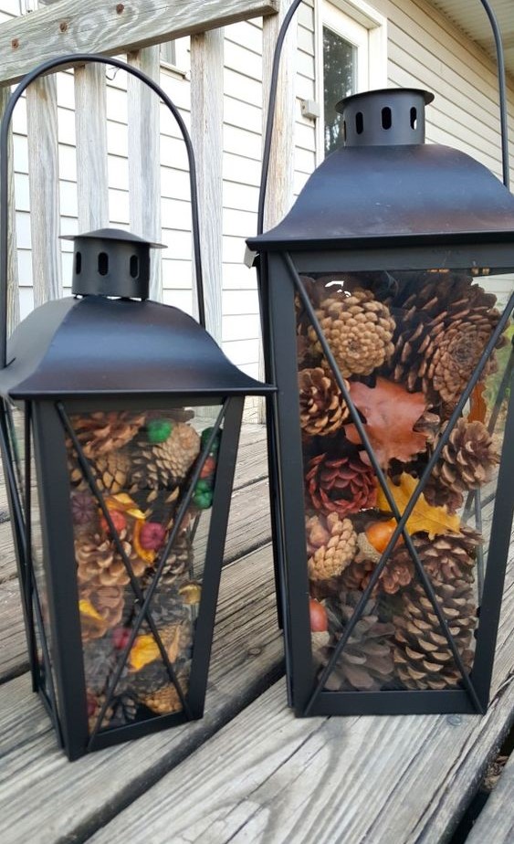 black metal lanterns with pinecones and colorful berries are great for fall and can be nice for winter, too