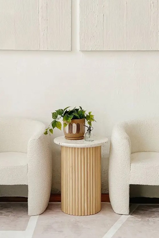 a fluted side table with a white terrazzo tabletop will be a fab addition to a modern and refined space