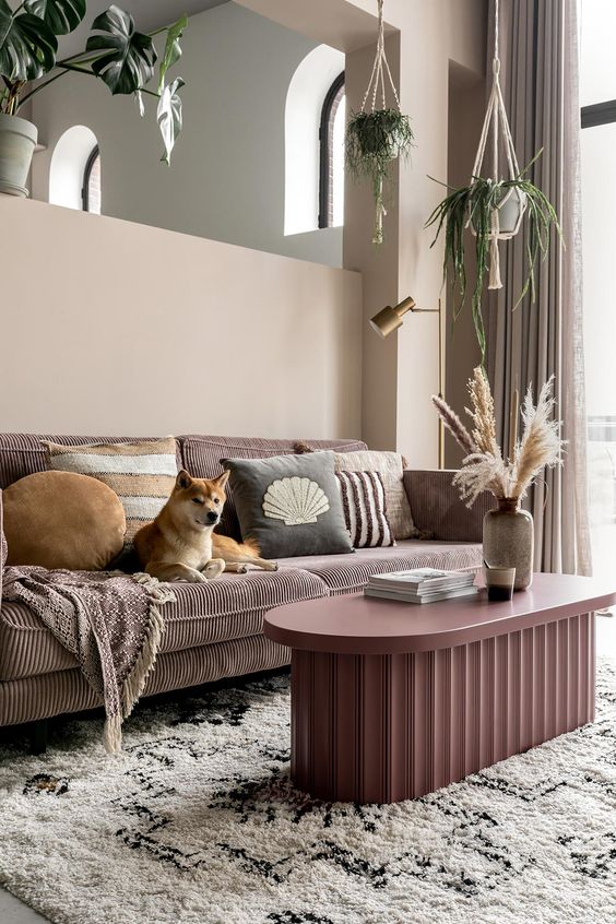 a lovely mauve coffee table with a fluted base is a stylish piece for a modern or Scandinavian space