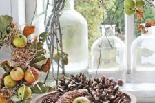 55 natural fall decor with pinecones and apples, leaves and branches is a perfect idea for a rustic, woodland or Scandinavian space