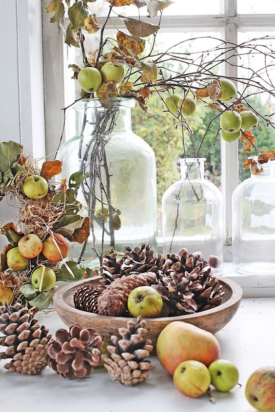 natural fall decor with pinecones and apples, leaves and branches is a perfect idea for a rustic, woodland or Scandinavian space