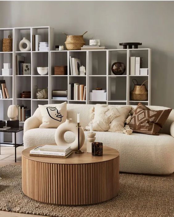 a stylish round coffee table with a fluted base and a sleek tabletop is a stylish solution for a modern space