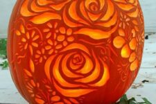 a bouquet of flowers carved on a pumpkin is a cool romantic piece suitable not only for Halloween but also for fall decor