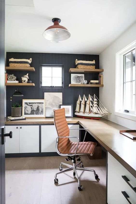 a coastal farmhouse home office with built-in cabinets and a desk, open shelves, baskets and some coastal decor