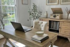 a lovely home office with a trestle desk