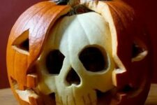 a cool halloween pumpkin with a skull inside