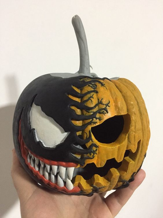 a gorgeous carved and painted Venom pumpkin with teeth is a perfect decoration, it looks stylish and scary